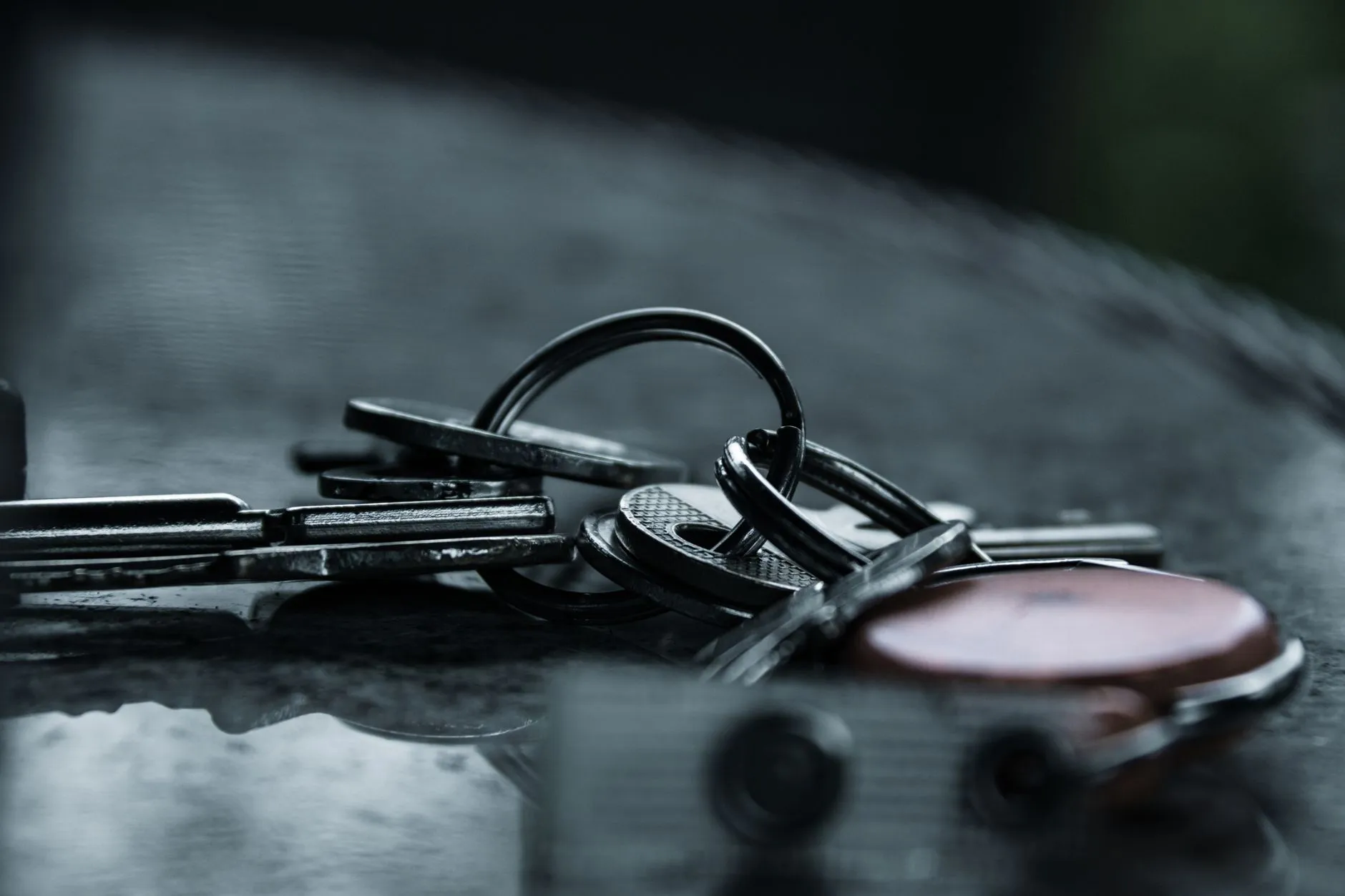 A locksmith working on a residential door lock
