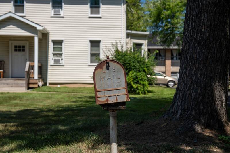 A mailbox at the curb of a suburban New Jersey home