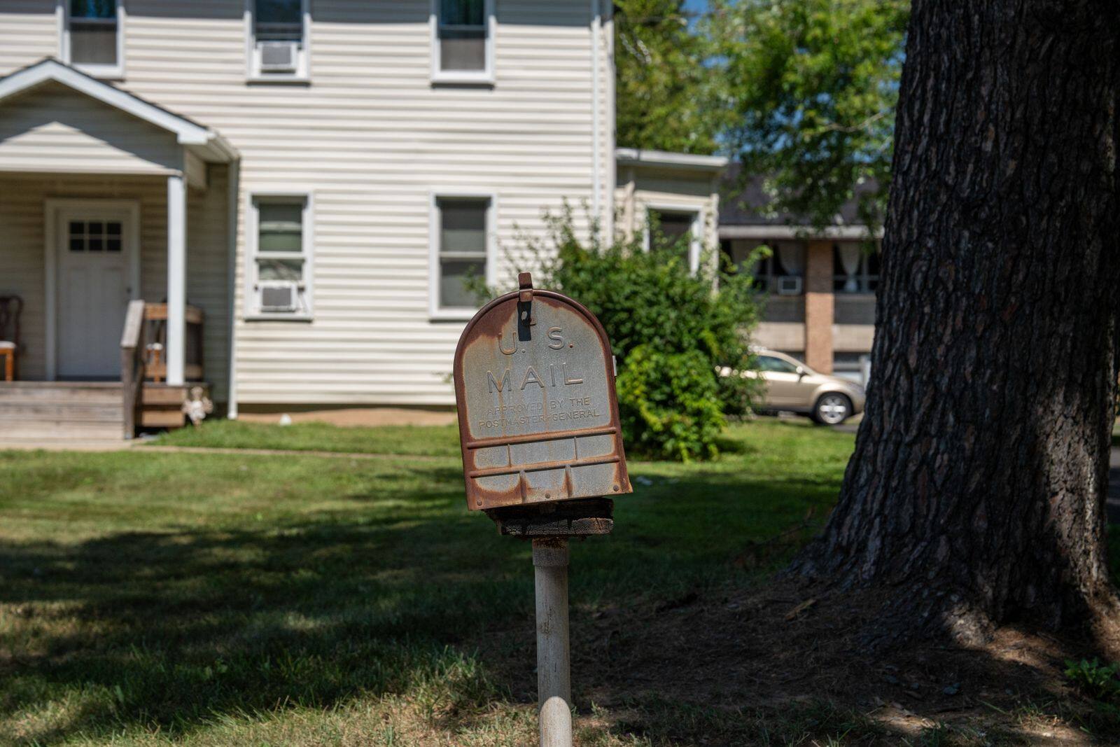 A mailbox at the curb of a suburban New Jersey home